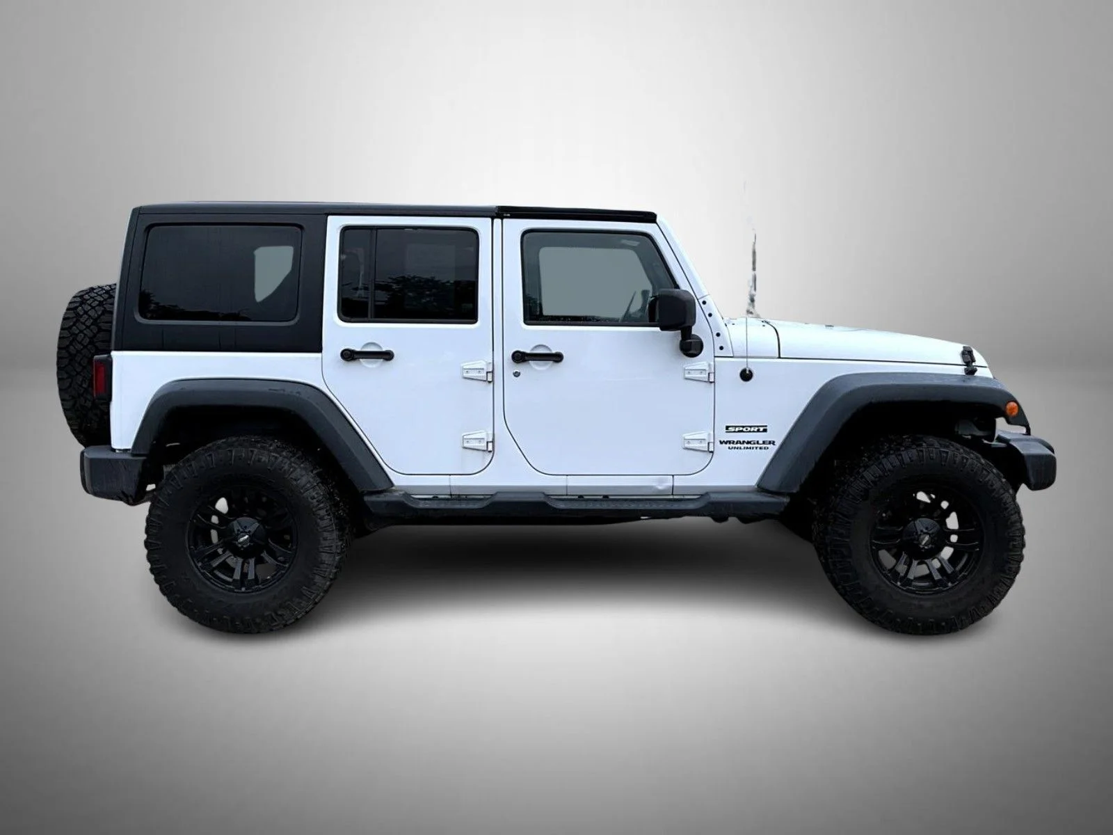 Used 2013 White Jeep Unlimited Sport image 4