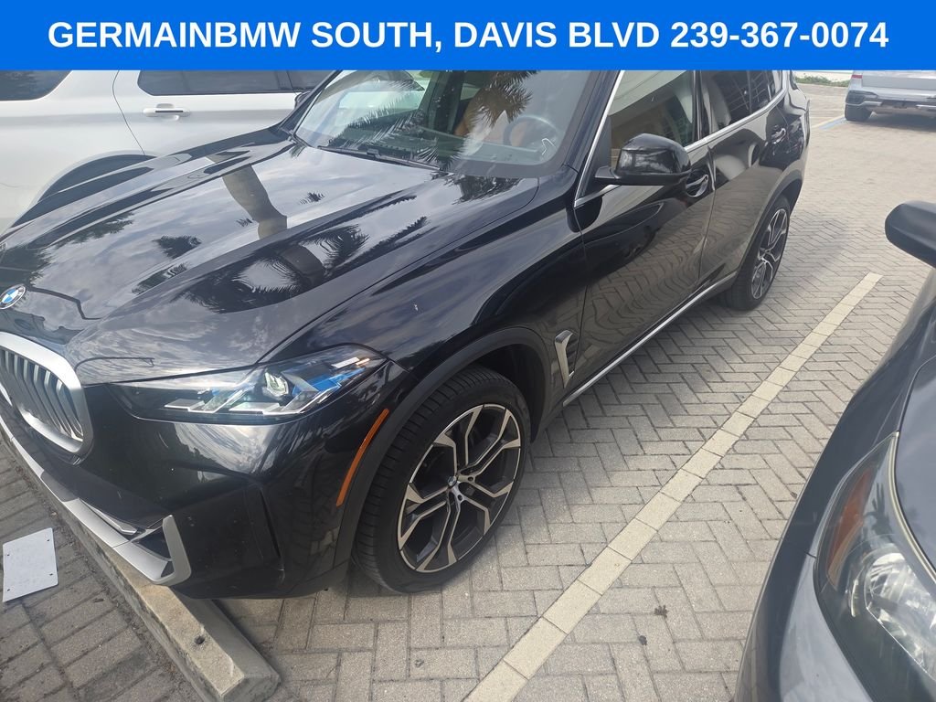 Certified Used 2024 Black Sapphire Metallic BMW sDrive40i image 2