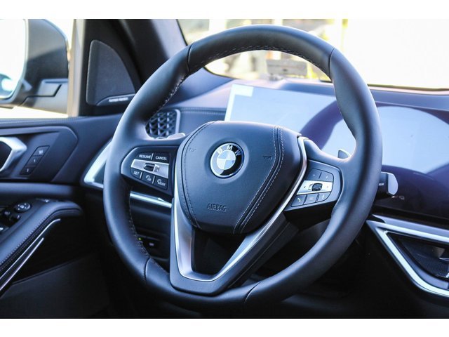 New 2026 Black Sapphire Metallic BMW xDrive50e image 11
