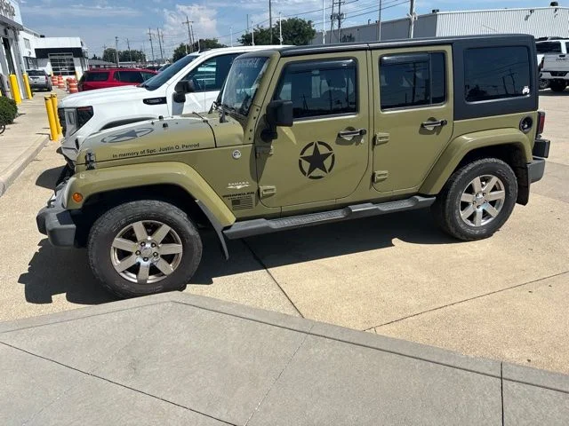 Used 2013 Green Jeep Unlimited Sahara image 1