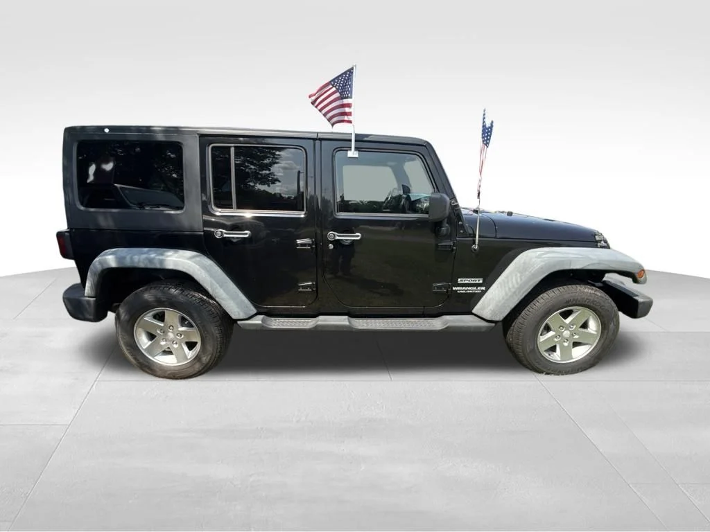 Used 2012 Black Jeep Unlimited Sport image 8
