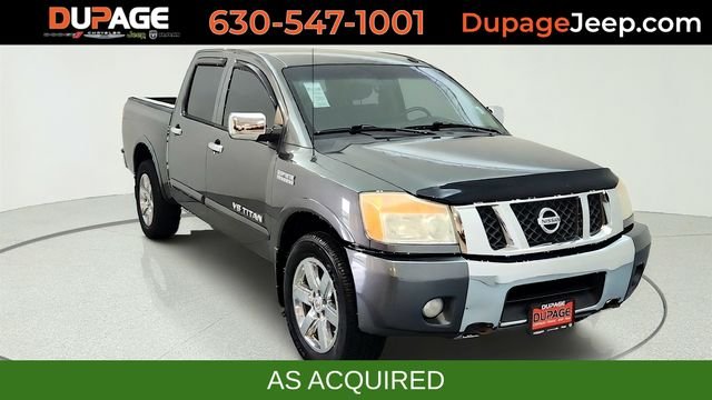 Silver (Smoke Metallic) 2010 Nissan Titan Pickup Truck Four-Wheel Drive 5-Speed Automatic