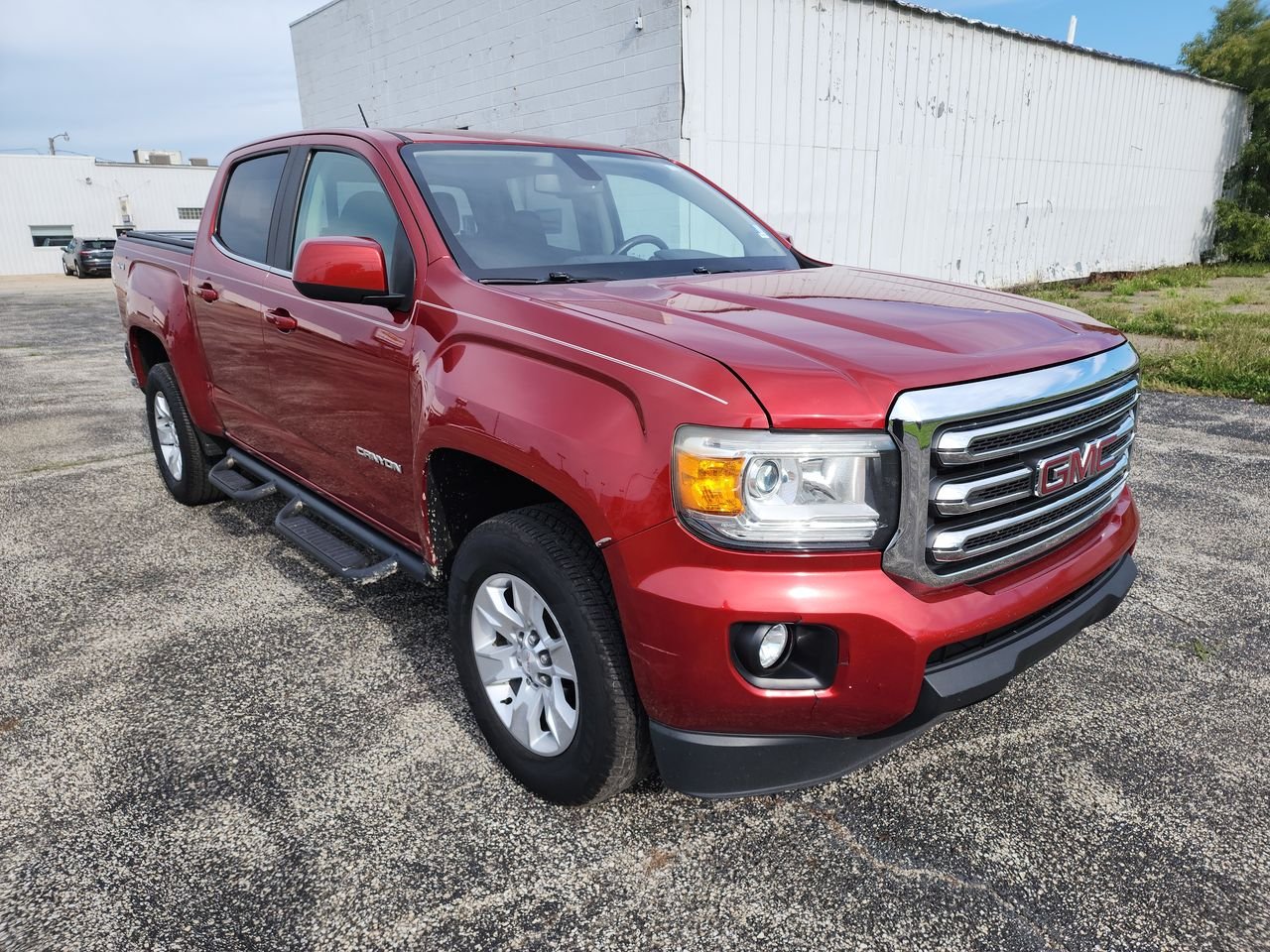 Used 2016 COPPER RED METALLIC GMC 4WD SLE image 1