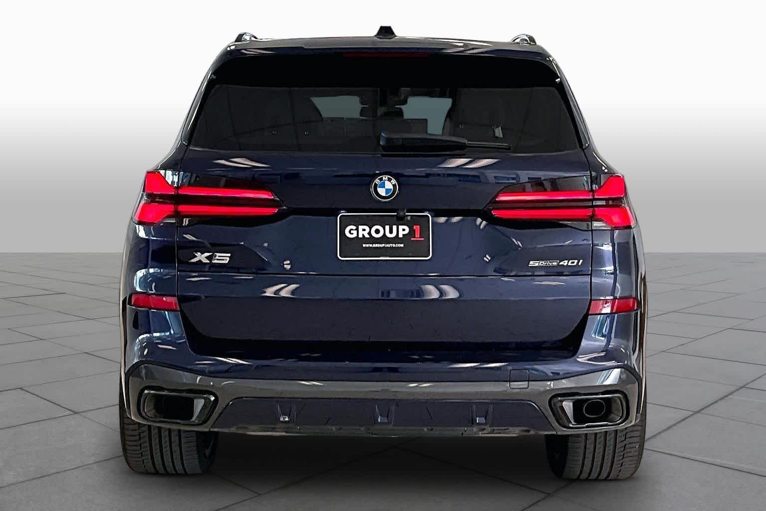 Used 2024 Tanzanite Blue II Metallic BMW sDrive40i image 4