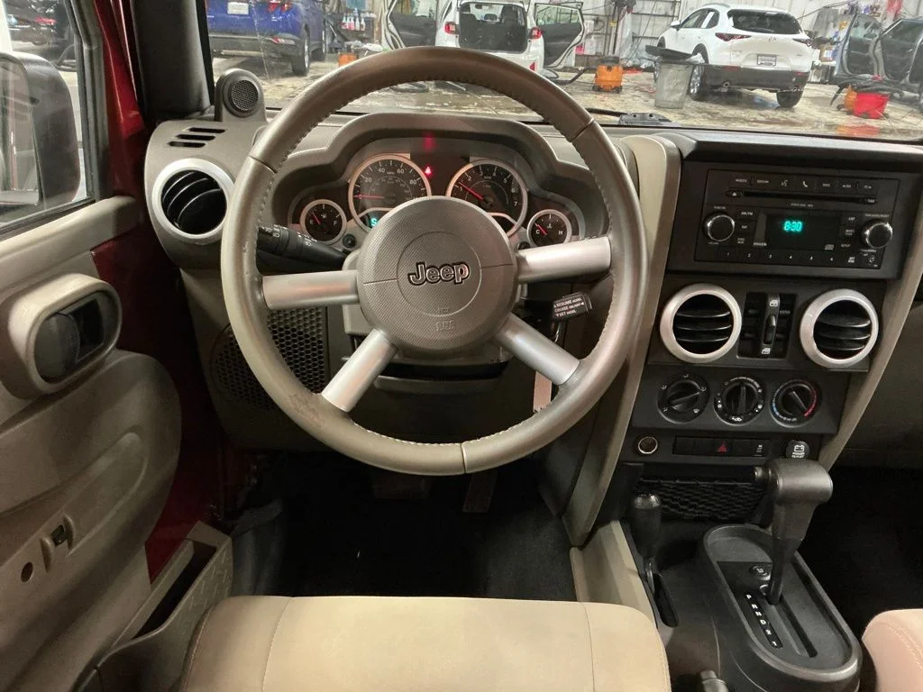 Used 2010 Red Jeep Unlimited Sahara image 16