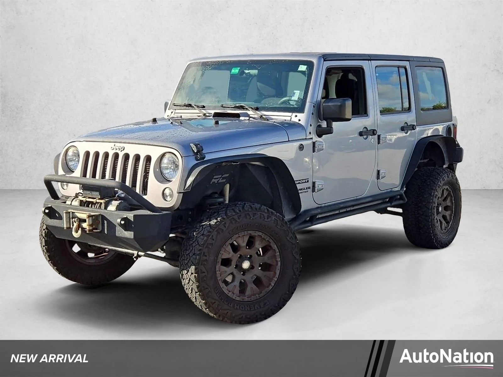 Used 2015 Billet Silver Metallic Clearcoat Jeep Sport image 1