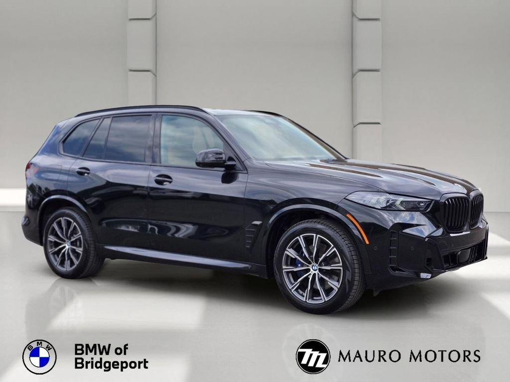 Used 2024 Black BMW xDrive40i image 1