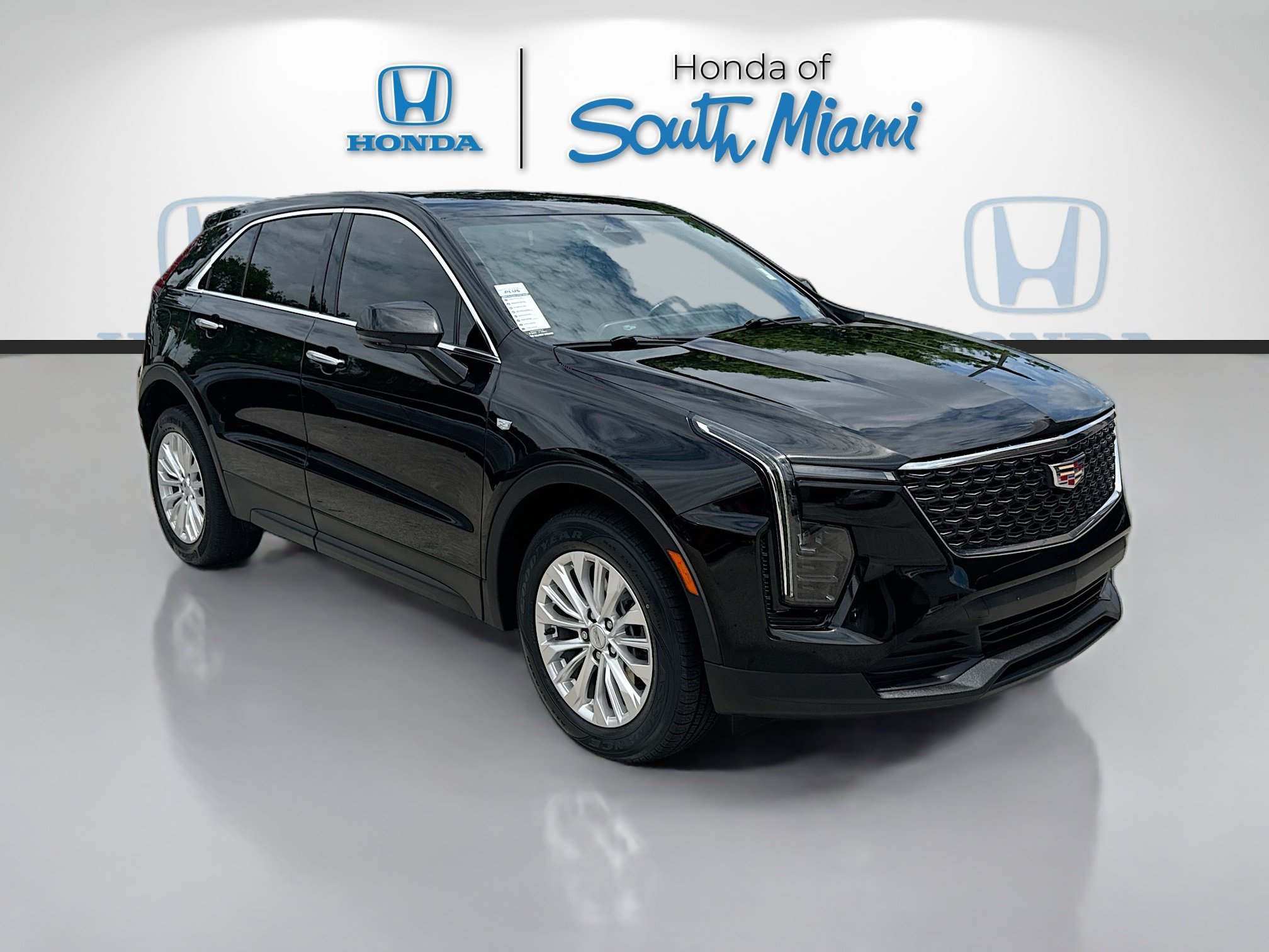 Used 2024 Stellar Black Metallic Cadillac FWD Luxury image 1