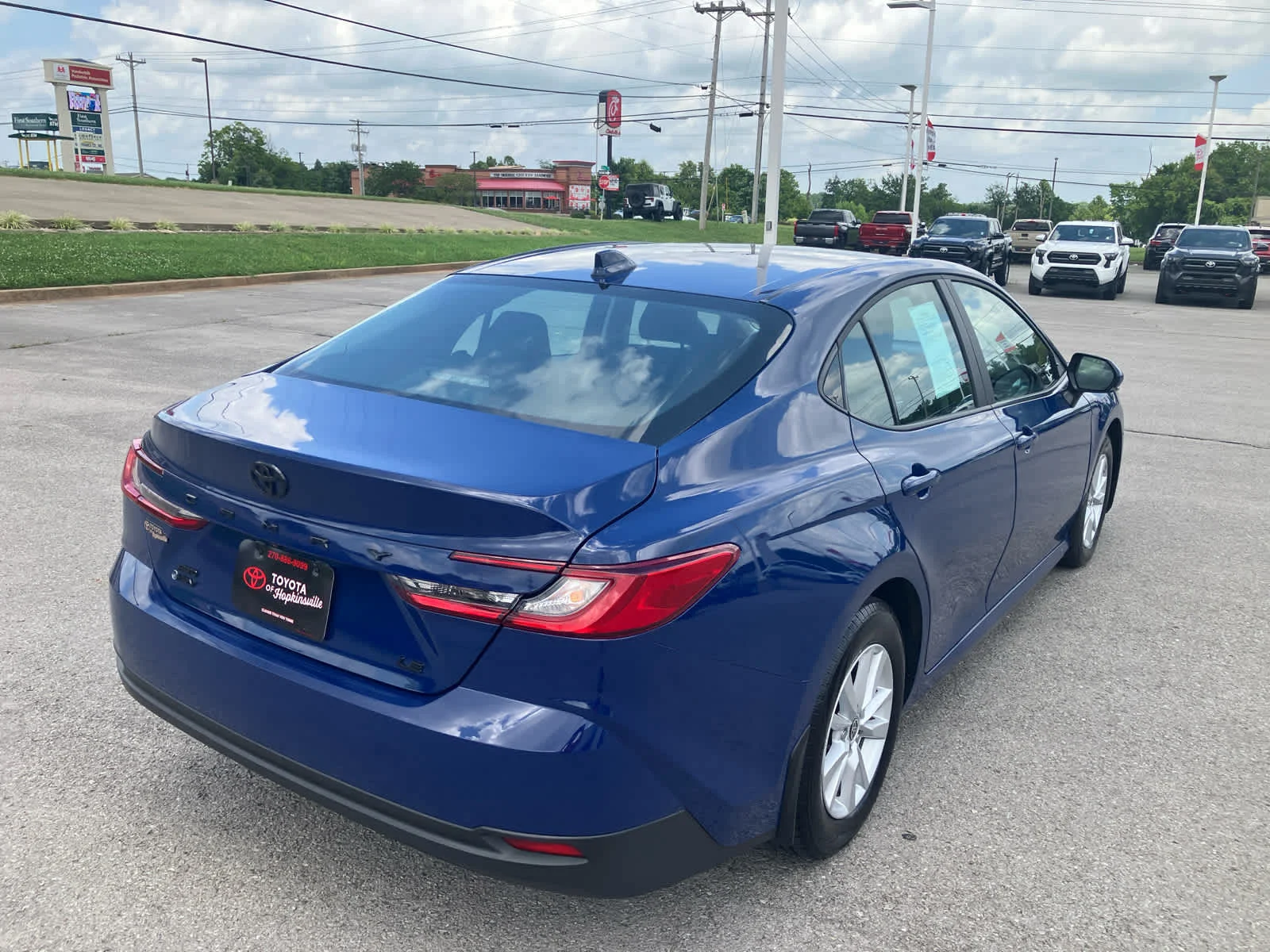 Used 2025 Reservoir Blue Toyota LE image 7