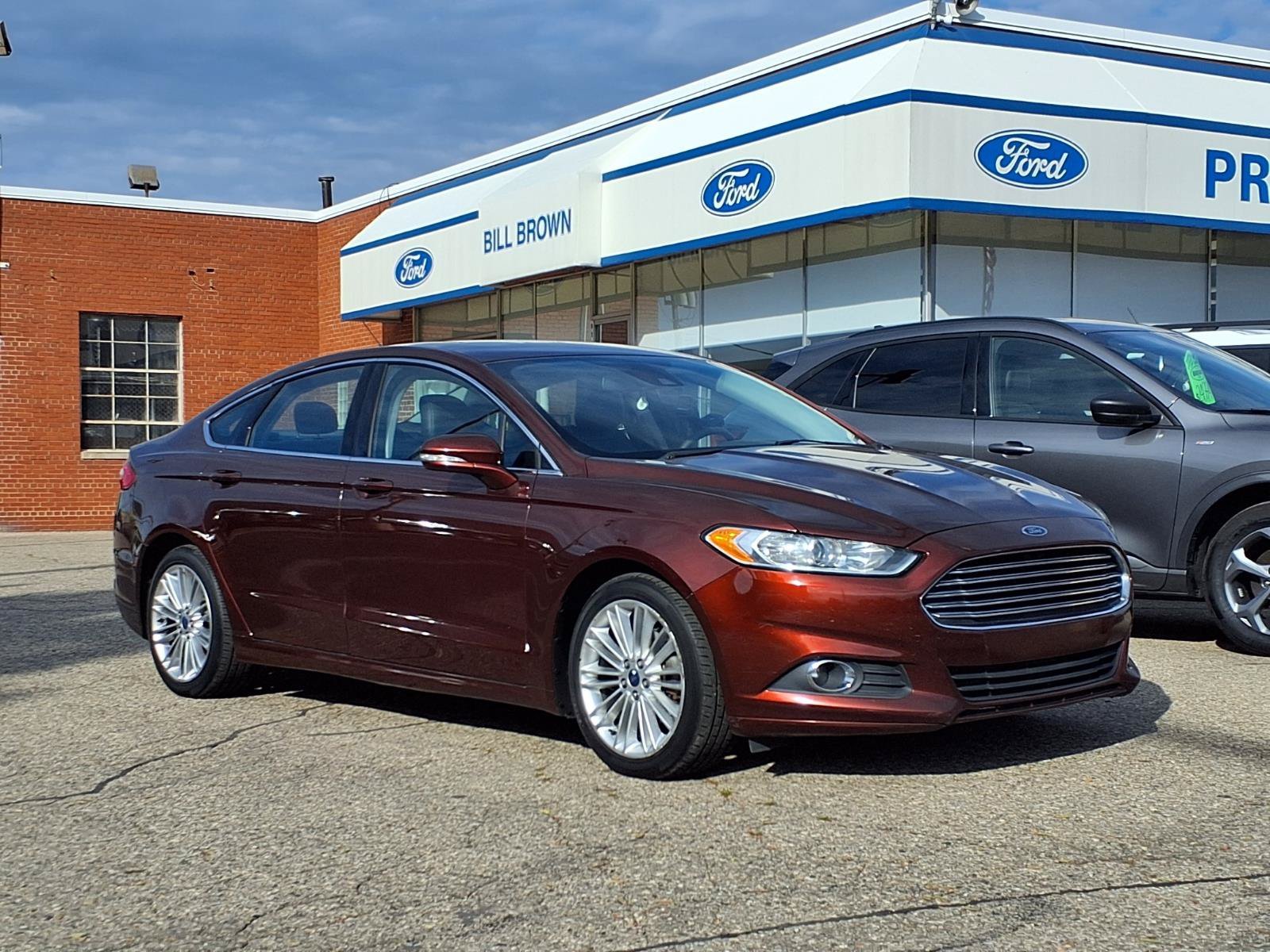 Used 2015 Bronze Fire Metallic Tinted Clearcoat Ford SE image 1