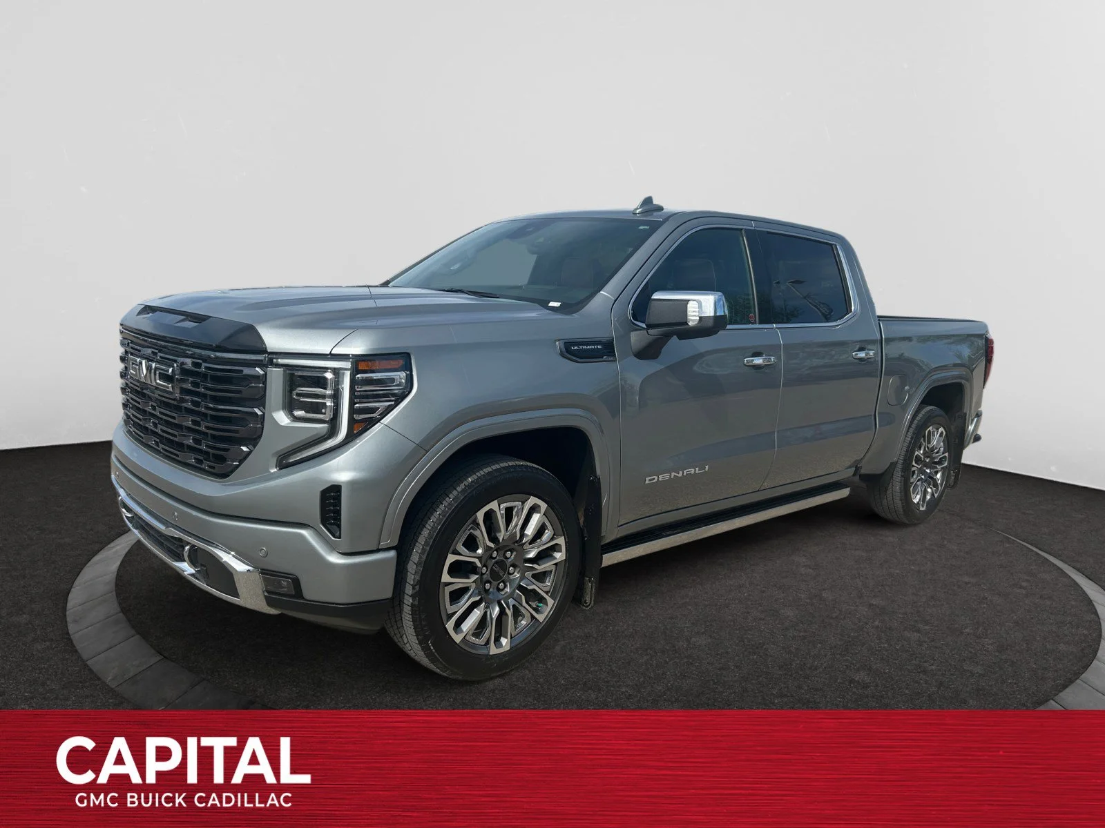 Used 2025 Silver GMC Denali Ultimate Crew Cab image 1