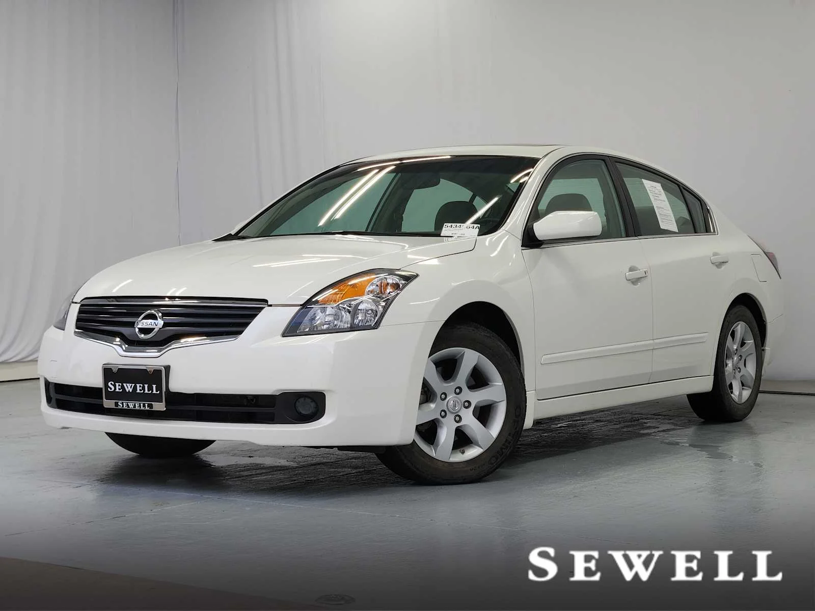 Used 2009 Winter Frost Pearl Nissan 2.5 SL image 1