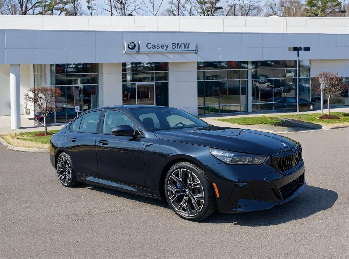 New 2027 Carbon Black Metallic BMW 550e xDrive image 1