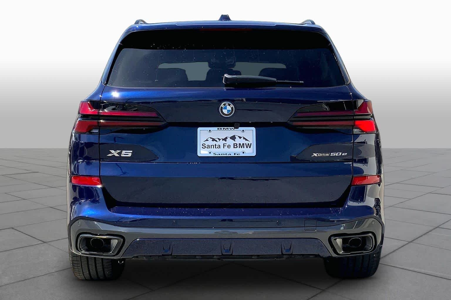 New 2026 Tanzanite Blue II Metallic BMW xDrive50e image 4