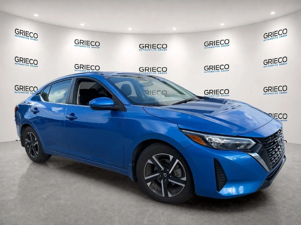 Used 2024 Electric Blue Metallic Nissan SV image 1