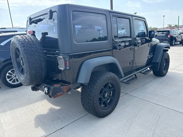 Used 2013 Black Jeep Unlimited Sport image 4