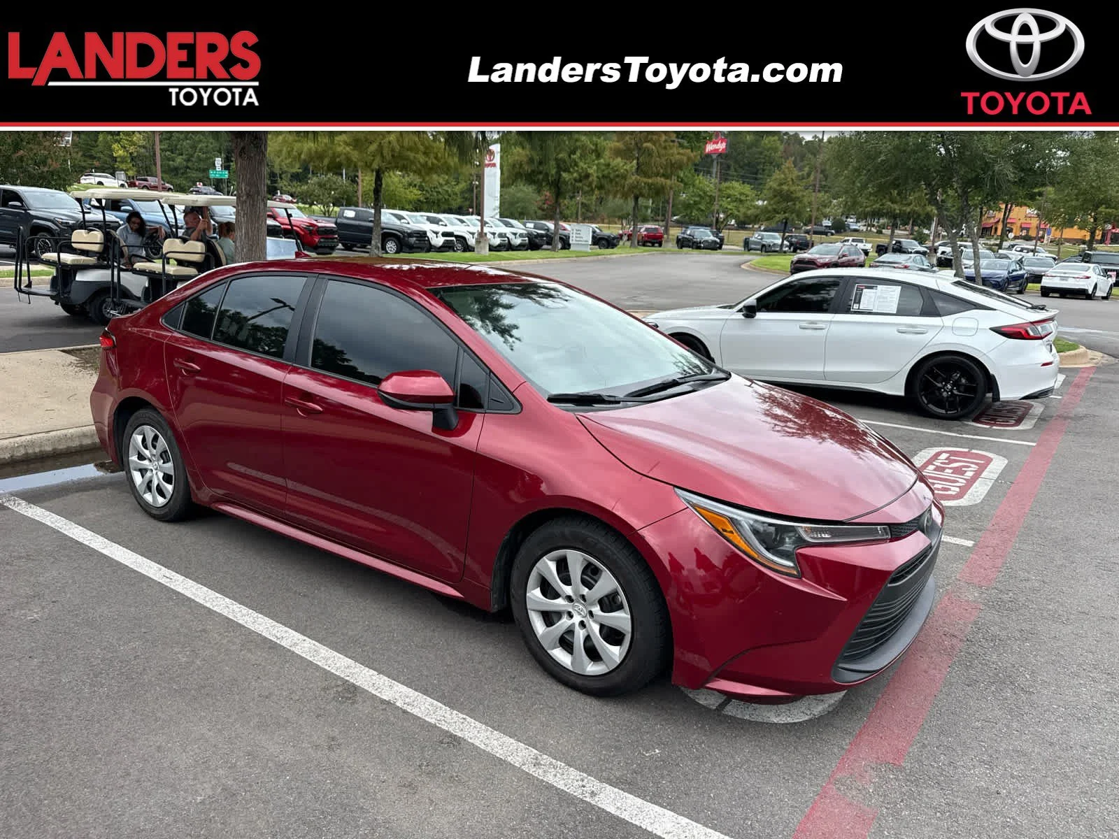 Used 2023 Ruby Flare Pearl Toyota LE image 1