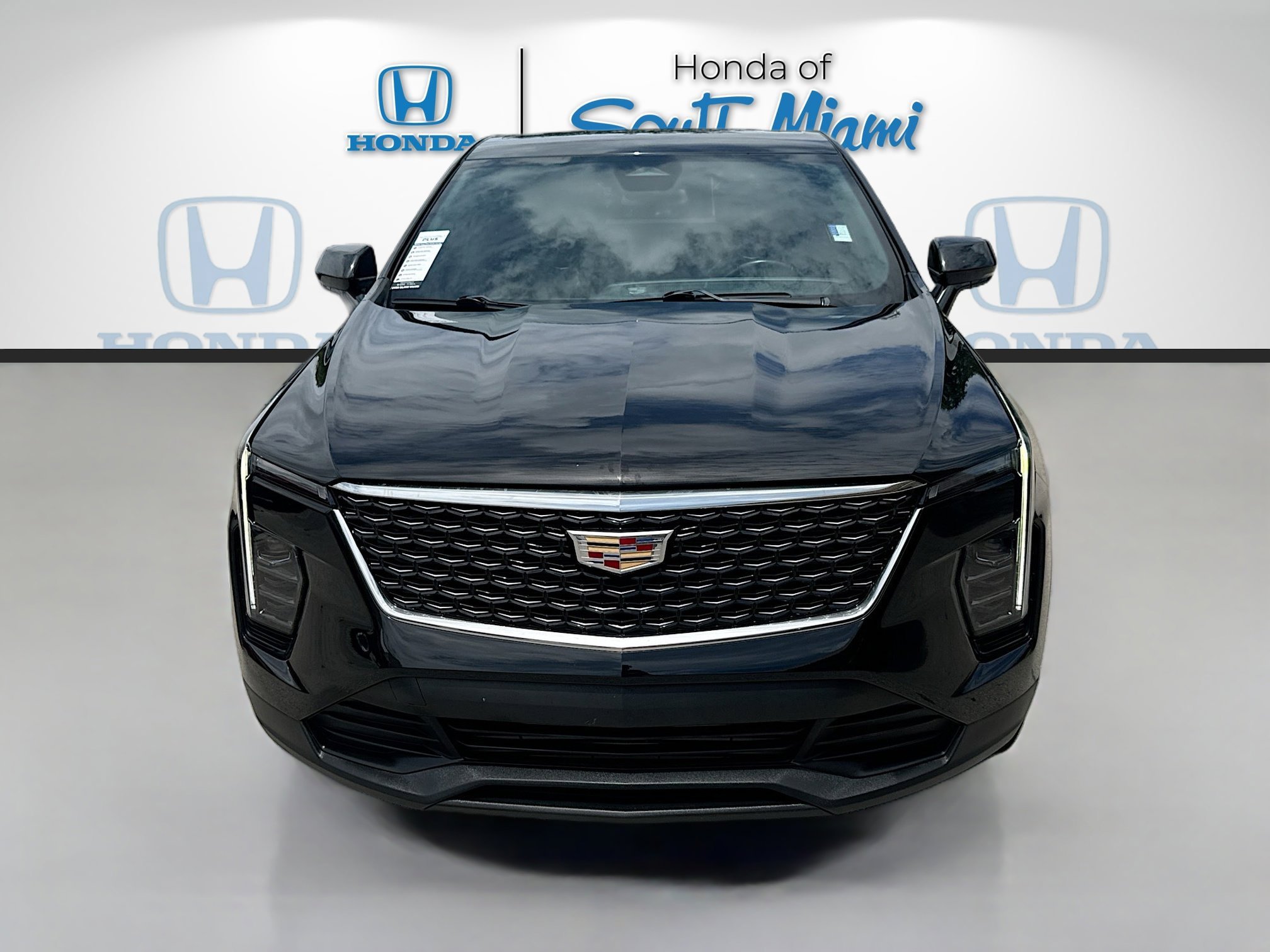 Used 2024 Stellar Black Metallic Cadillac FWD Luxury image 2