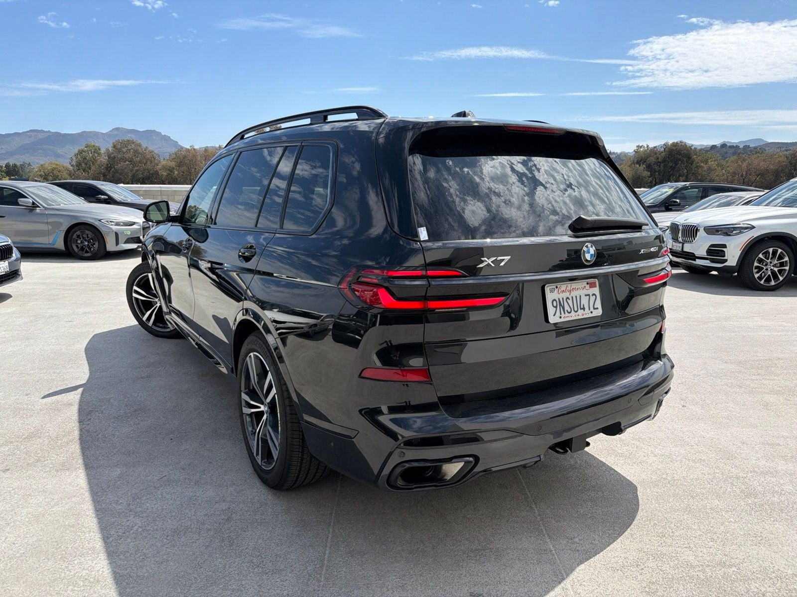 Certified Used 2024 Black Sapphire Metallic BMW xDrive40i image 2