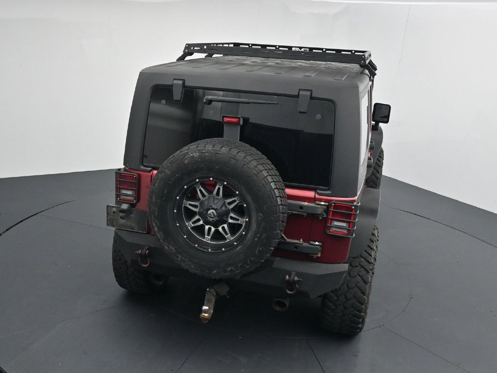 Used 2012 Red Jeep Unlimited Sport image 14