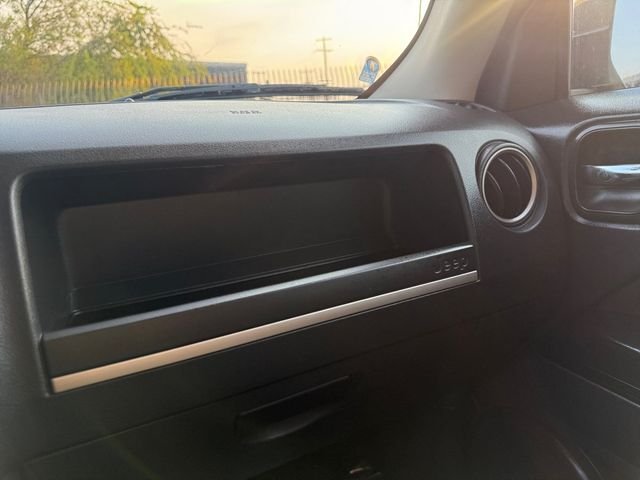 Used 2016 Granite Crystal Clearcoat Metallic Jeep Sport image 26