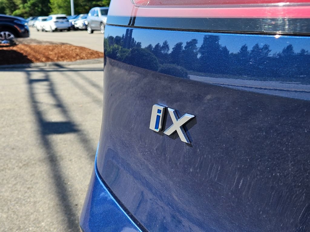 Certified Used 2025 Blue BMW xDrive50 image 10