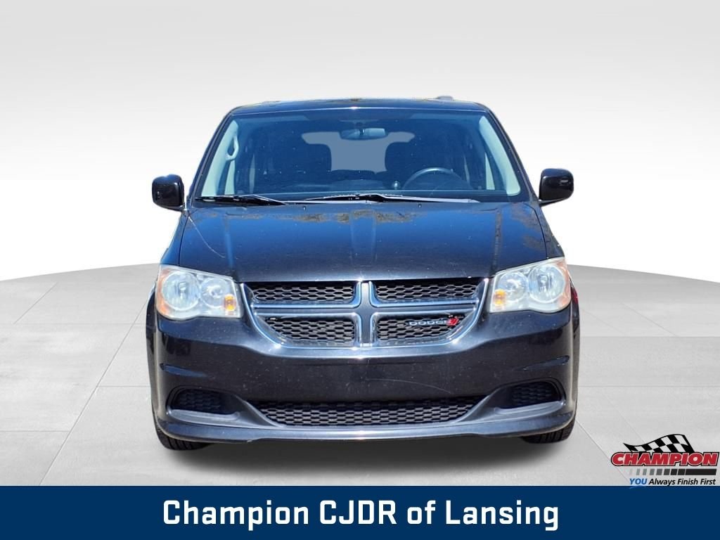 Used 2013 Dodge Grand Caravan SXT with VIN 2C4RDGCGXDR581130 for sale in Lansing, MI
