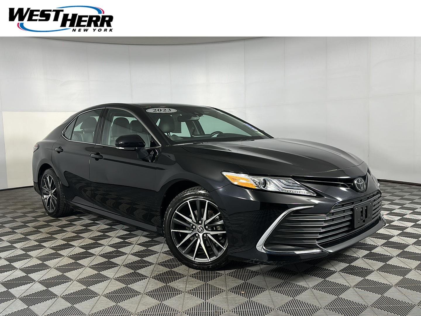 Used 2023 Midnight Black Metallic Toyota XLE image 1