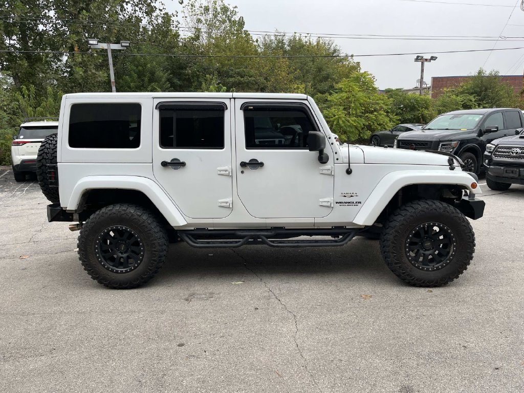 Used 2016 White Jeep Unlimited Sahara image 2