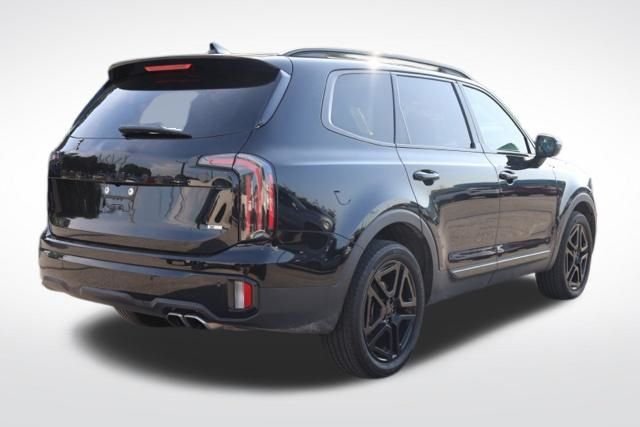 Used 2025 Ebony Black Kia EX X-Line image 11