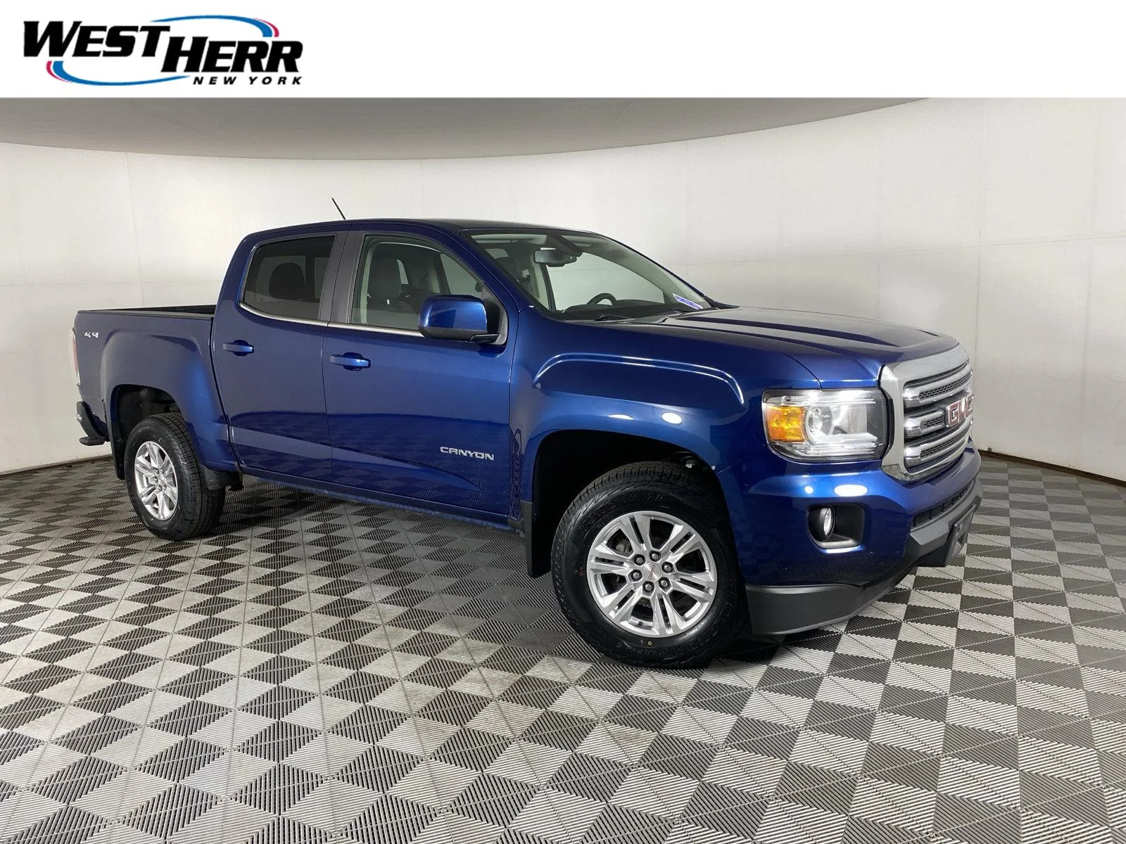 Used 2020 Blue Emerald Metallic GMC 4WD SLE image 1