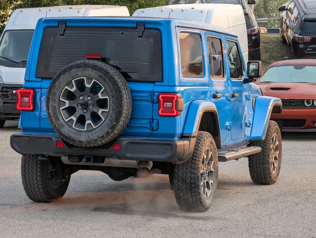 Used 2024 Blue Jeep Sahara - - 4x4 - Leather Seats - Power Soft Top - Remote Start & More! image 8