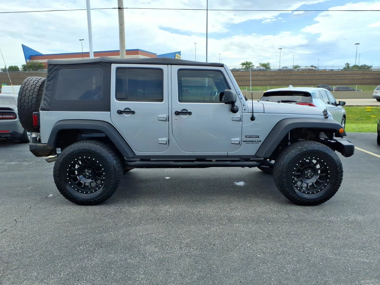 Used 2013 Billet Silver Metallic Jeep Sport image 25