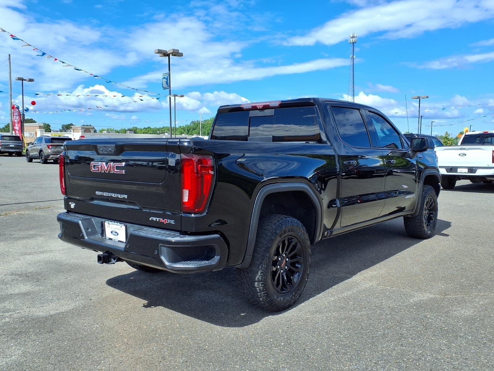 Used 2023 Onyx Black GMC AT4X image 2