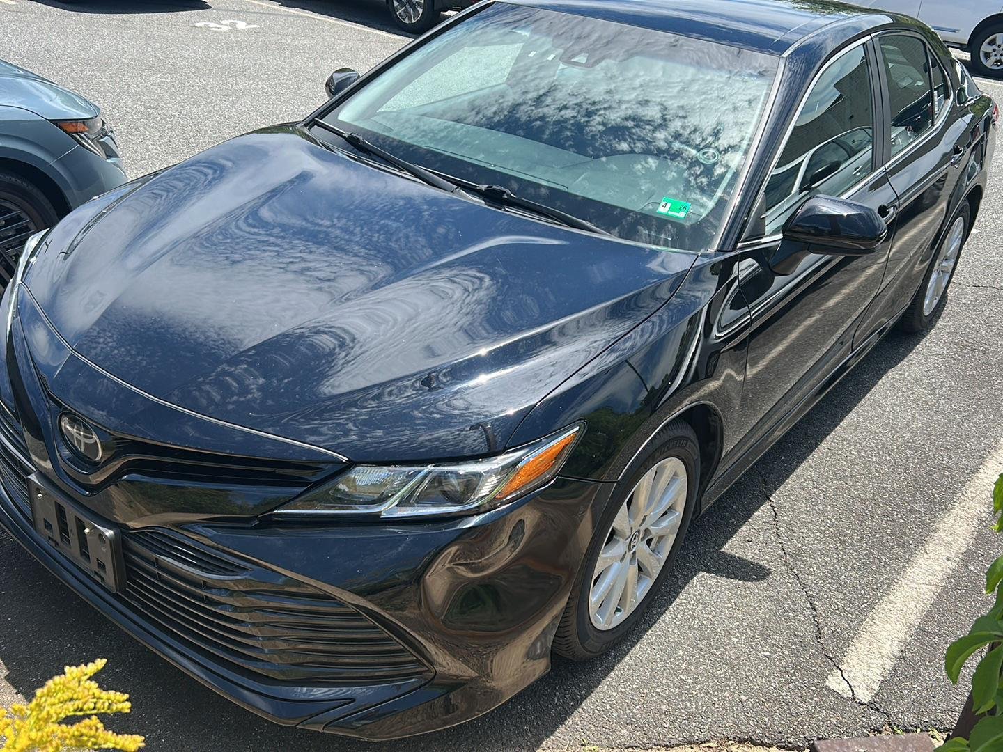 Used 2020 Midnight Black Metallic Toyota LE image 1