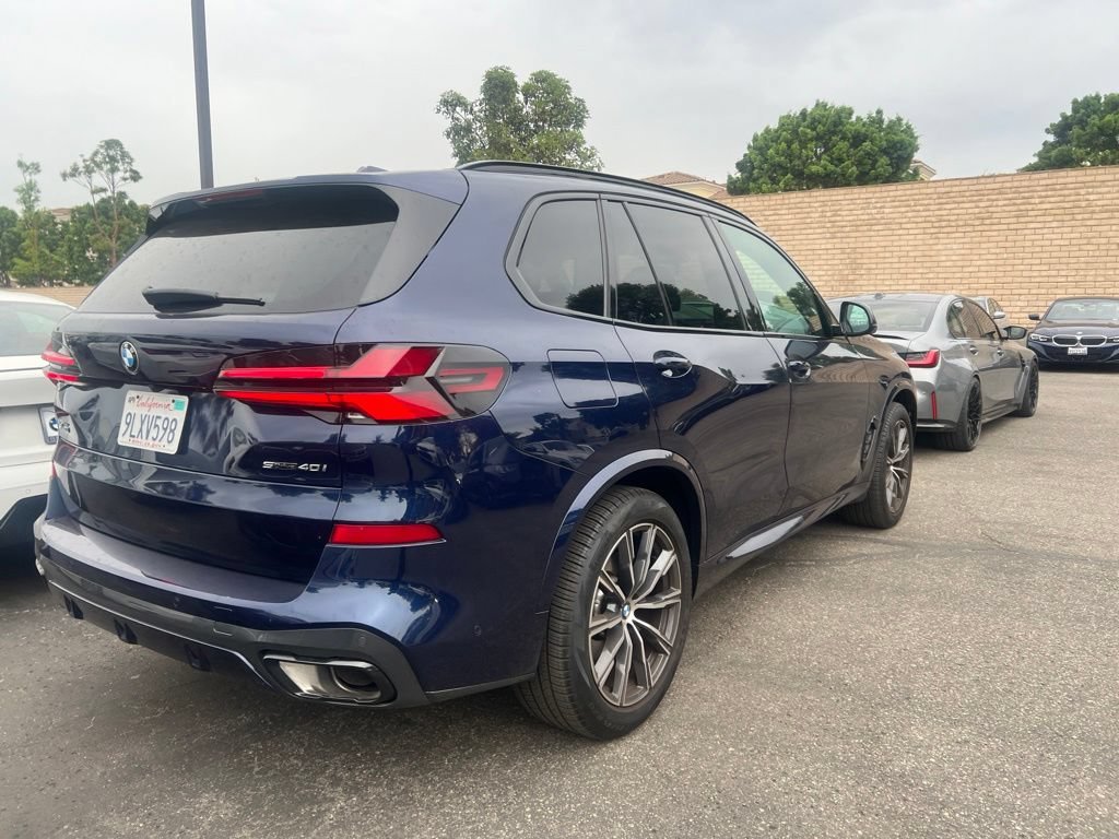 Used 2024 Tanzanite Blue II Metallic BMW sDrive40i image 4