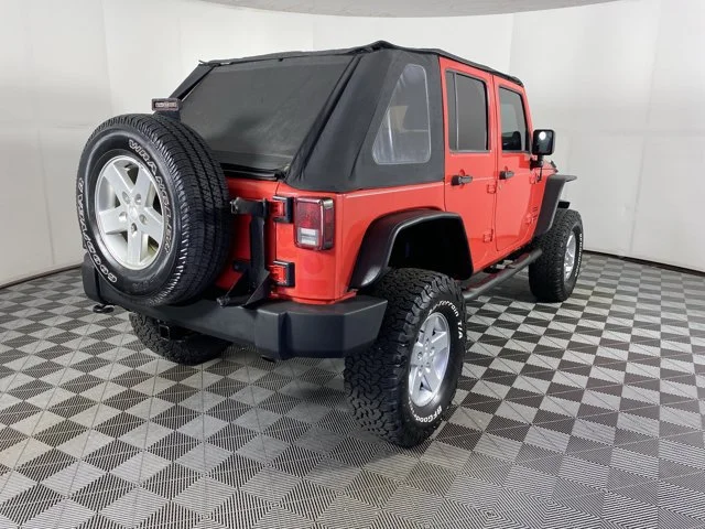 Used 2013 Red Jeep Unlimited Sport image 3