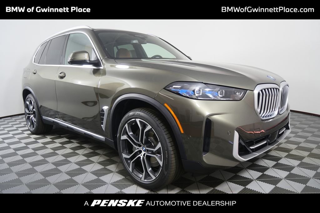 New 2026 Manhattan Green Metallic BMW xDrive50e image 1
