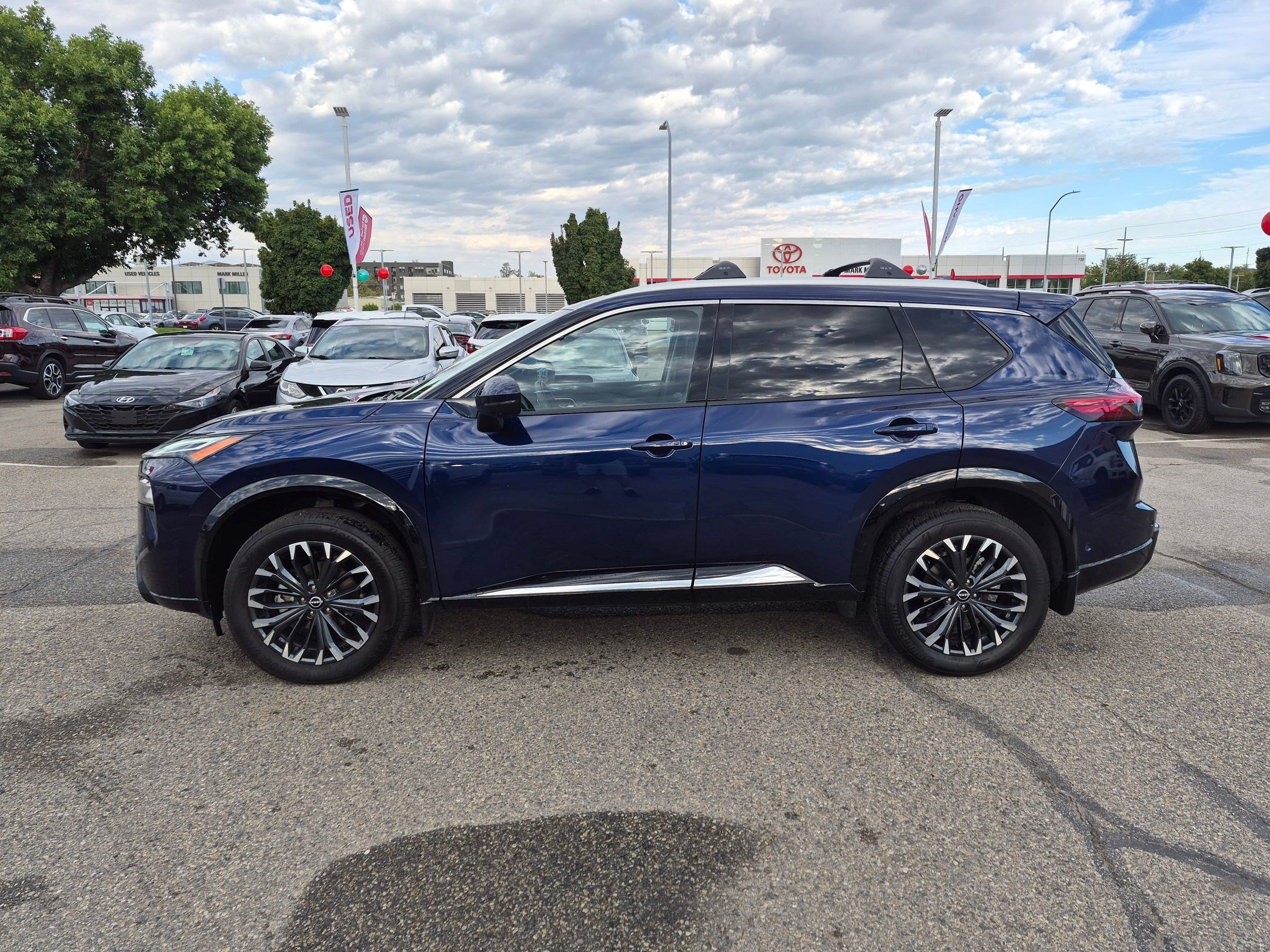 Used 2026 Deep Ocean Blue Pearl Nissan Platinum image 8