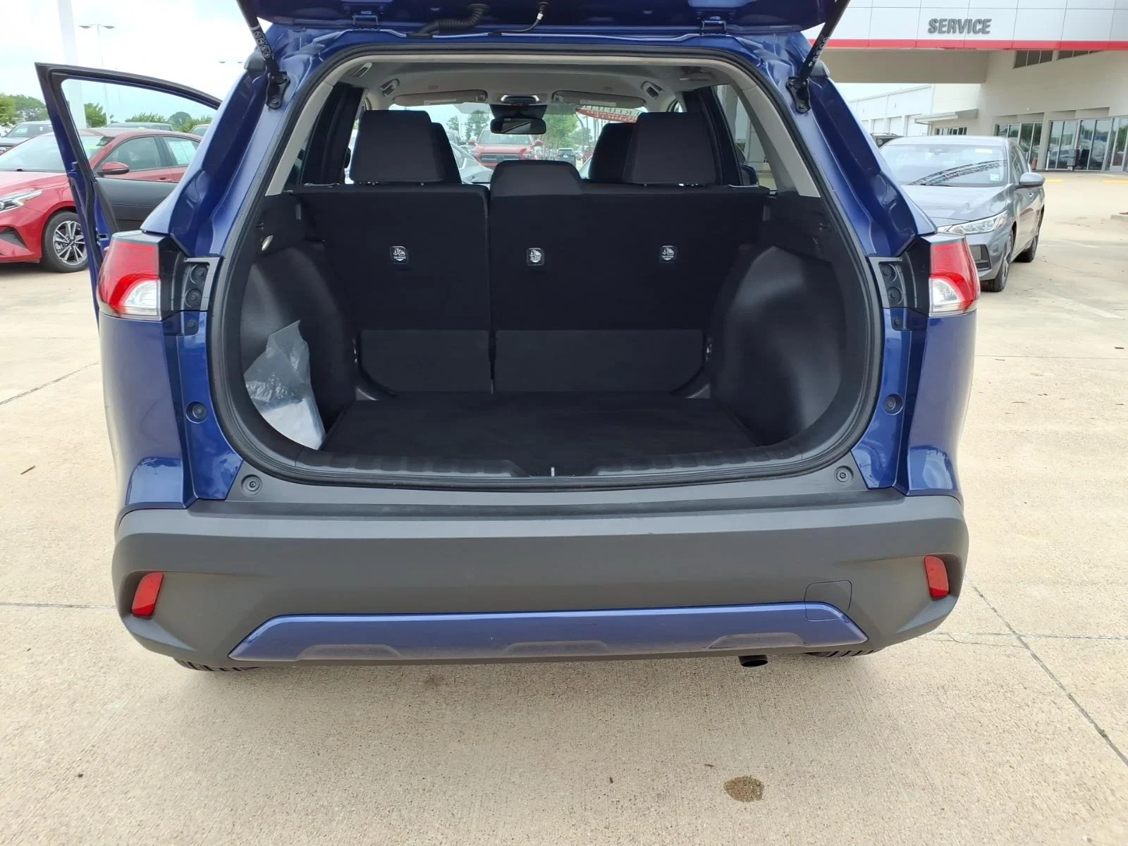 Used 2024 Blue Crush Metallic Toyota LE image 18