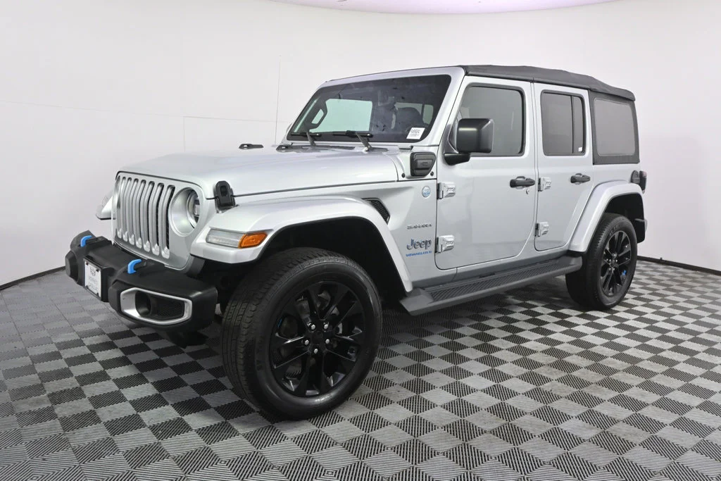 Used 2023 Jeep Wrangler 4xe Sahara 4XE with VIN 1C4JJXP66PW555241 for sale in Minneapolis, Minnesota