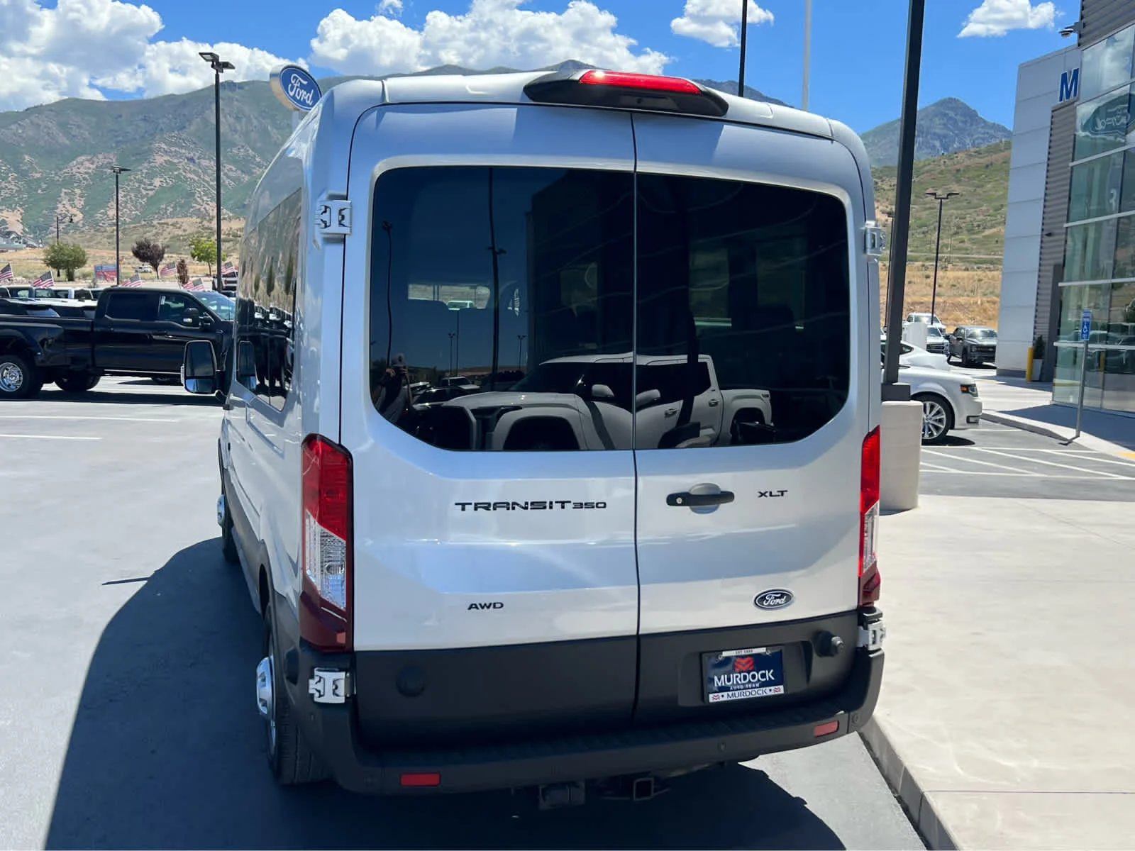 New 2026 Ingot Silver Metallic Ford Passenger Van XLT image 10