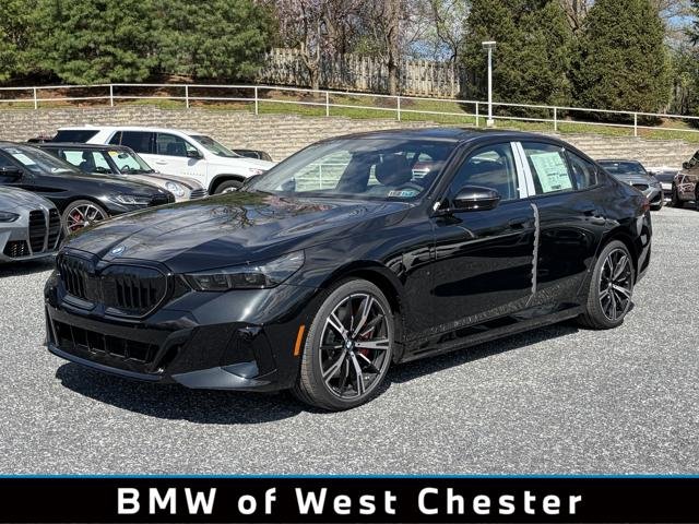 New 2026 Black Sapphire Metallic BMW 550e xDrive image 1