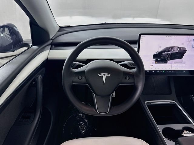 Used 2023 Solid Black Tesla Performance image 19