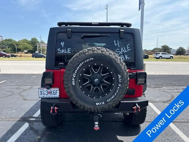 Used 2015 Firecracker Red Jeep Unlimited Sport image 9
