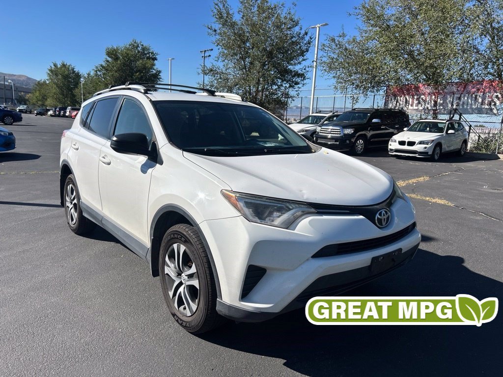 Used 2016 Super White Toyota LE image 1