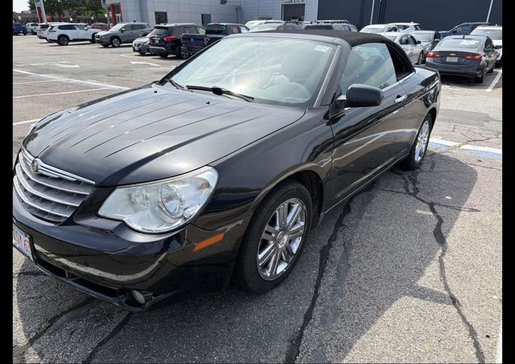 Used 2009 Black Chrysler Limited image 1