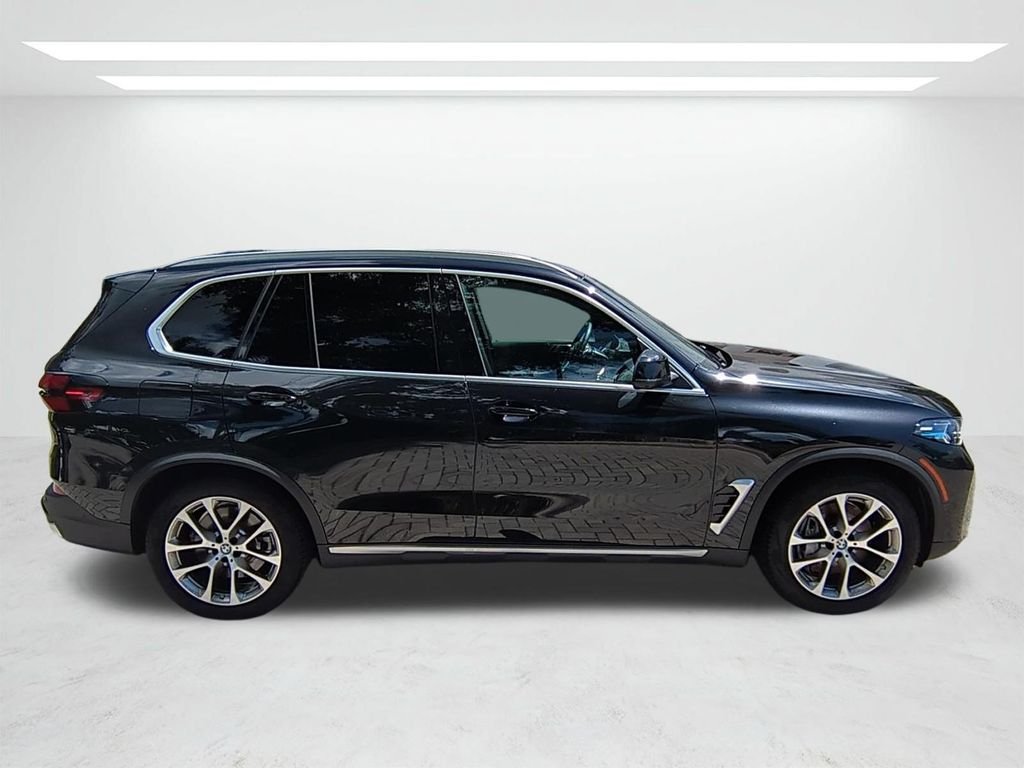 New 2026 Black Sapphire Metallic BMW xDrive50e image 3