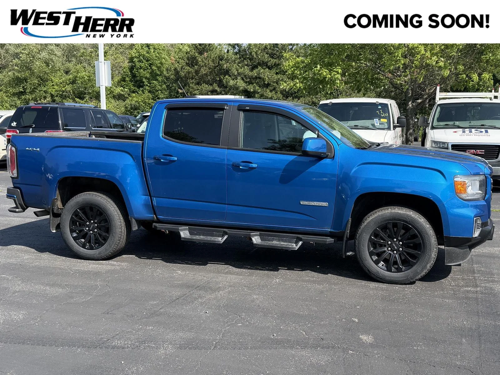Used 2022 Dynamic Blue Metallic GMC 4WD Elevation image 1