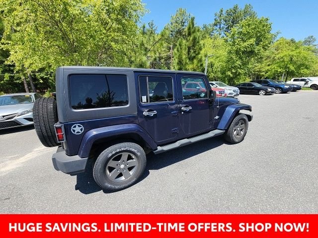 Used 2013 Blue Jeep Unlimited Sport image 17